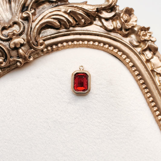 Gold and Red Rhinestone Charm (January)