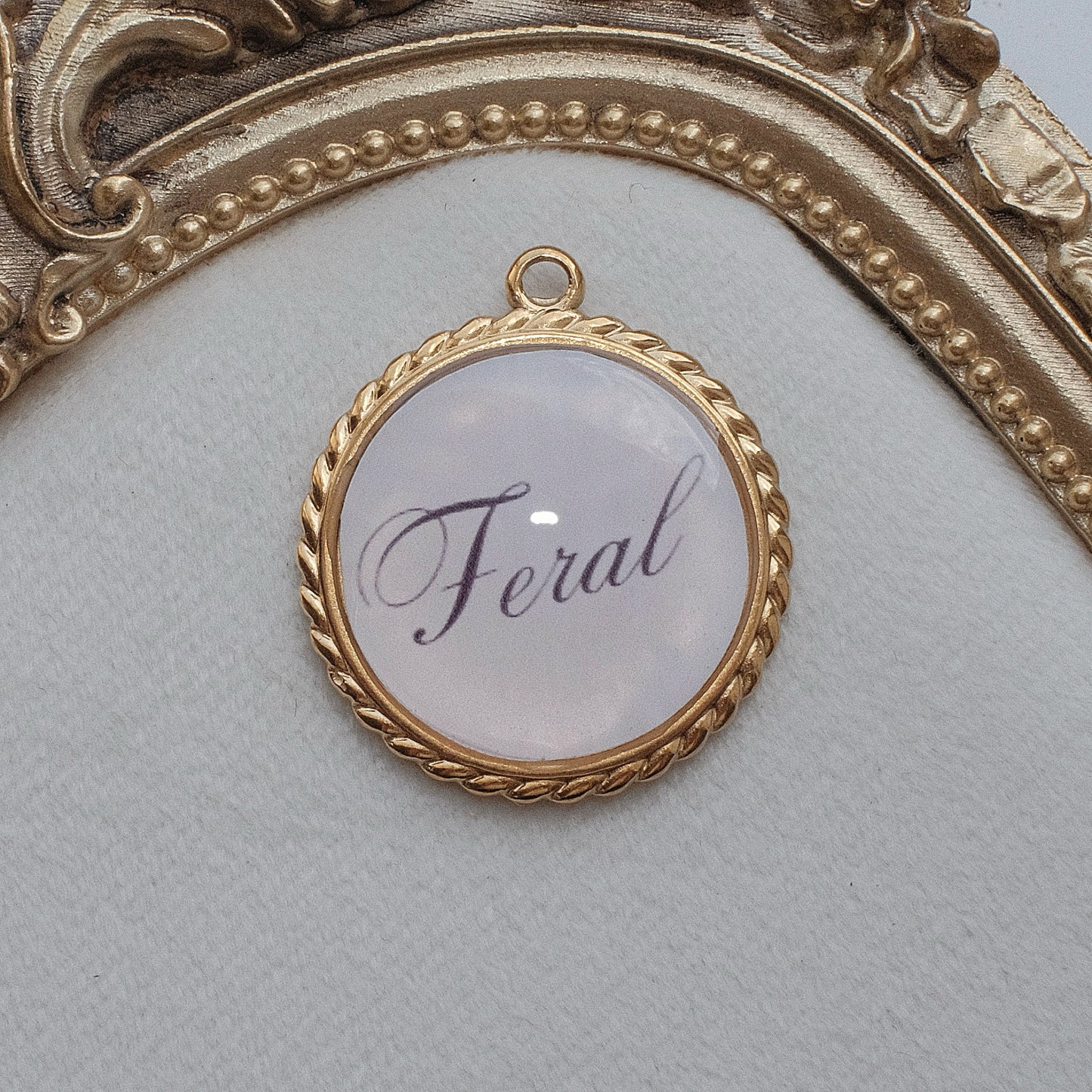 Gold Feral Charm
