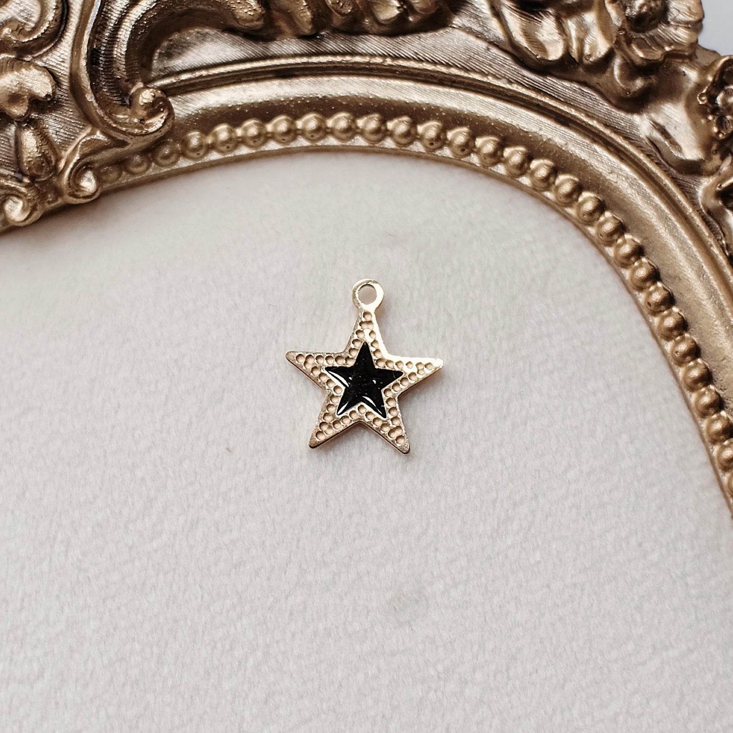 Gold and Black Star Charm